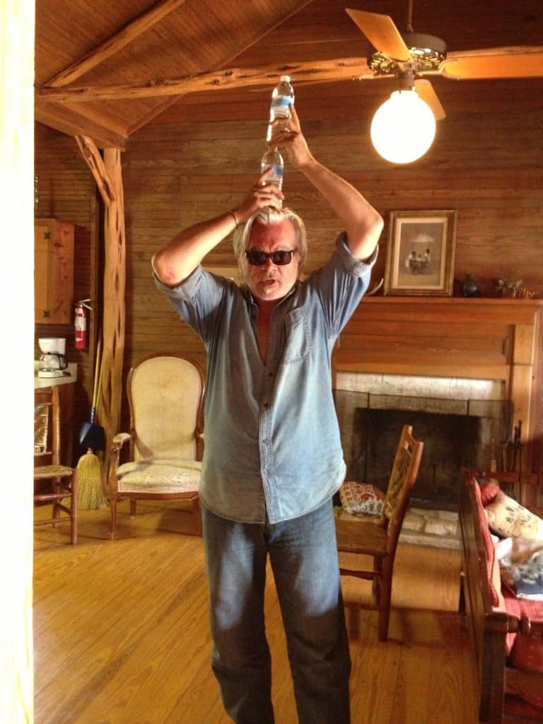 Hal Ketchum balancing water bottles on his head