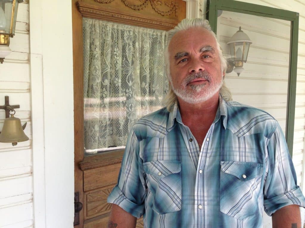 Hal Ketchum on the porch in D'Hanis