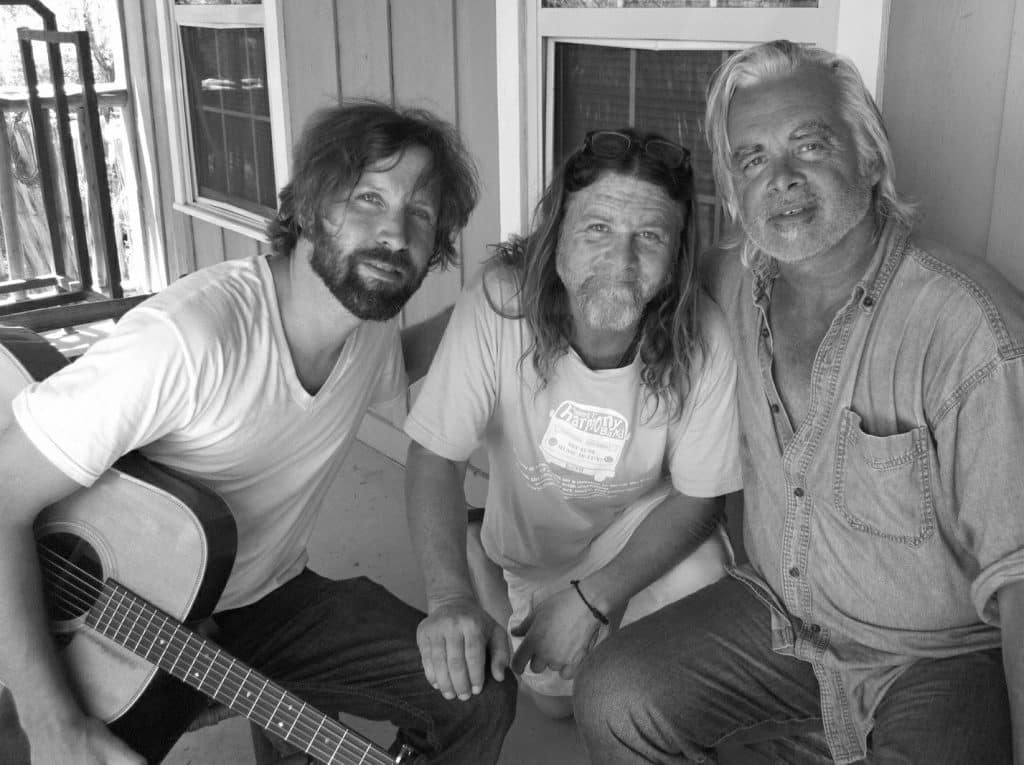 Owen Temple, Walt Wilkins and Hal Ketchum on a cabin porch